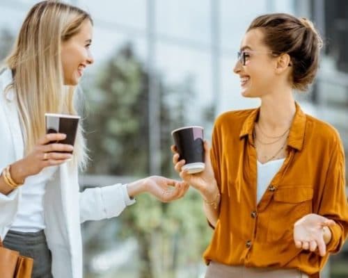 Two professional women making small talk